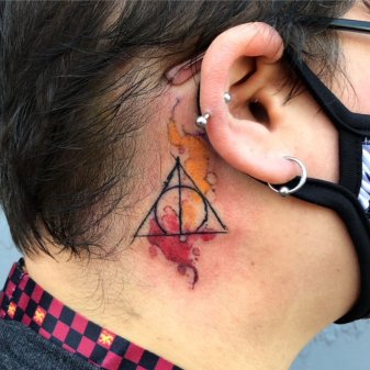 A deathly hollows tattoo behind the ear A very subtle and delicate idea to  pay a tribute to something thats been so big in  Ear tattoo Picture  tattoos Tattoos