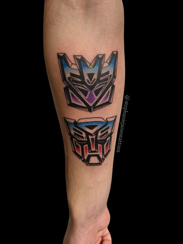 Got my first tattoo today! I decided to do a fusion of the Autobot and  Decepticon logos and I think it turned out really cool! : r/transformers
