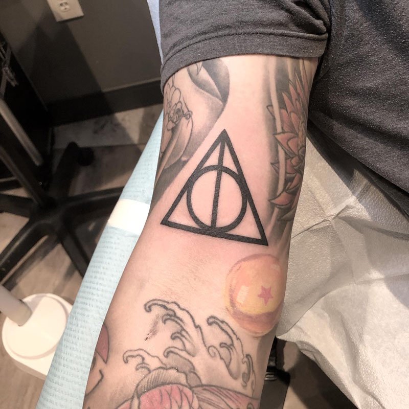 Tattoo uploaded by Styrmirink  55 yo first tattoo Harry potter Deathly  hallows Lotus flower  Tattoodo